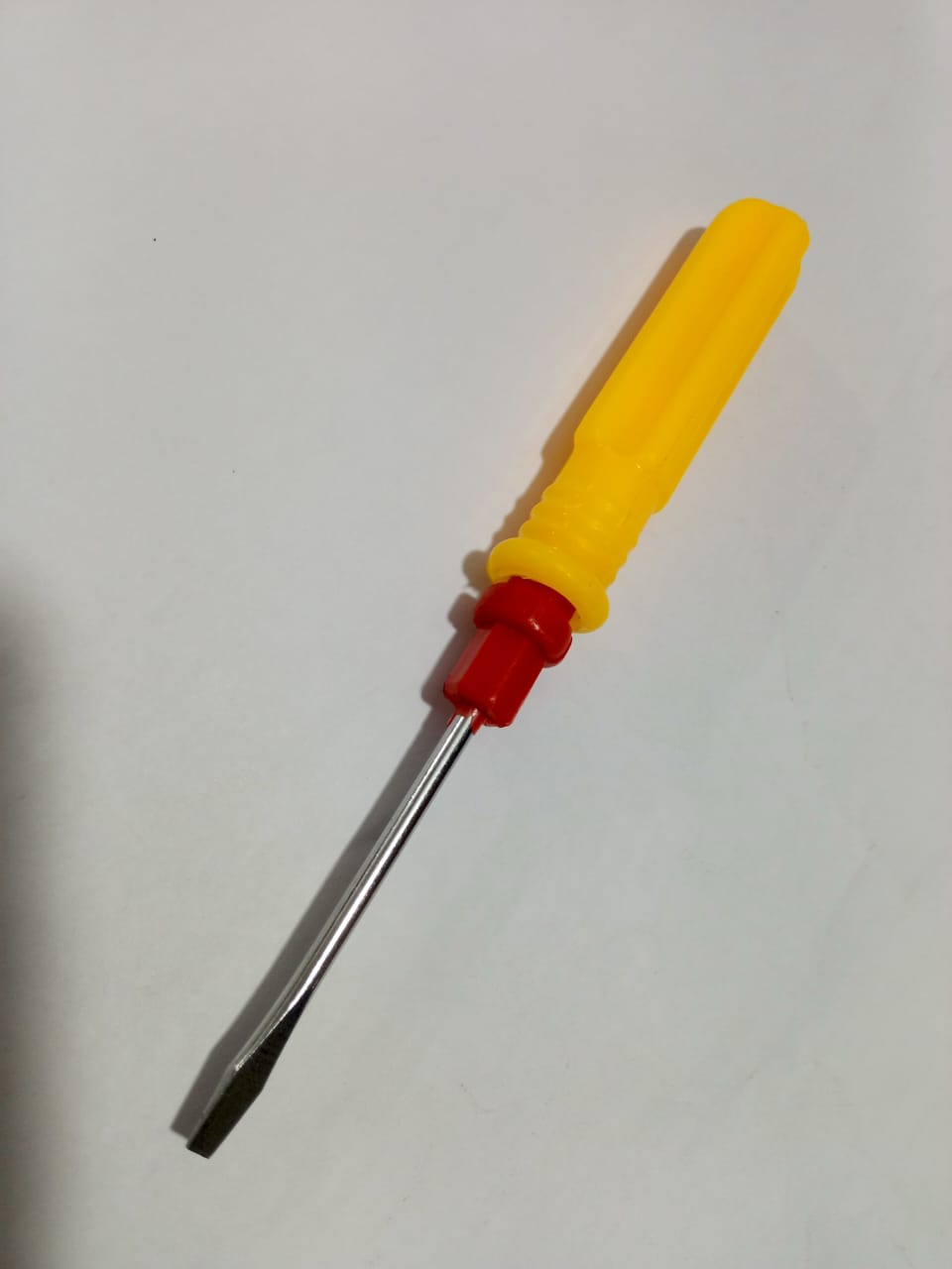 Double Head Plastic Handle Screwdriver - shown with a flat-head tip, a red plastic collar, and a yellow fluted handle against a white background.
