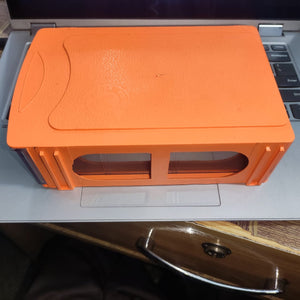 Drawer Storage Box 190MMX120MMX50MM - an orange rectangular plastic storage unit with two clear front-facing windows, resting on a laptop keyboard.