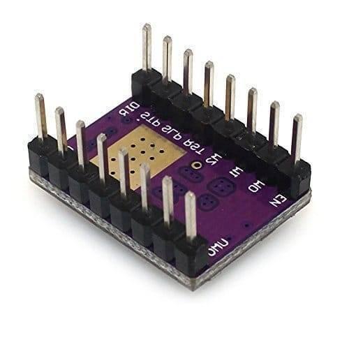 DRV8825 Stepper Motor Driver With Aluminum Heat Sink - a purple rectangular circuit board with two rows of vertical metal connector pins and a square gold-colored contact pad.