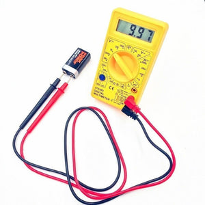 DT830D Digital Multimeter - a digital display reading 9.97, a central rotary dial, and red and black test leads connected to a 9V battery.