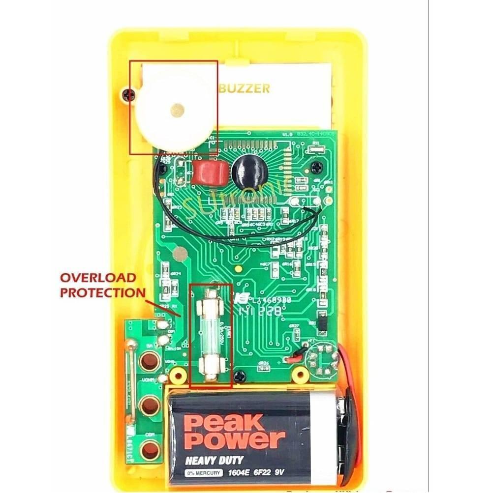 DT830D Digital Multimeter - the yellow plastic casing, green circuit board, 9V battery, fuse, and buzzer component.