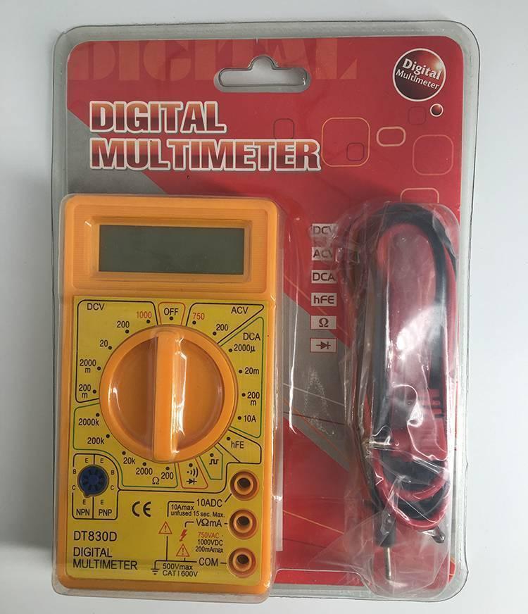 DT830D Digital Multimeter - in its original plastic blister packaging, featuring a yellow handheld meter with a rotary dial, probe leads, and blank screen.