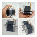 Dual Shaft NEMA 23 2A Stepper Motor For CNC 3d Printer - shown in a four-panel composite view featuring its grey square body, dual rotating shafts, and a four-pin connector.