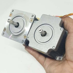 Dual Shaft NEMA 23 2A Stepper Motor For CNC 3d Printer - shown as a close-up of two silver and black metal stepper motors held in a hand.