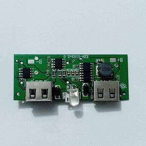Dual USB 18650 Battery Charger Power Bank Module 5V 1A 2A - a green circuit board with two USB ports, a central LED, and B+ and B- solder pads.