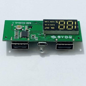 Dual USB 18650 Battery Charger Power Bank Module 5V 1A 2A - a green circuit board with two USB ports, a micro-USB port, a button, an LED, and a display.