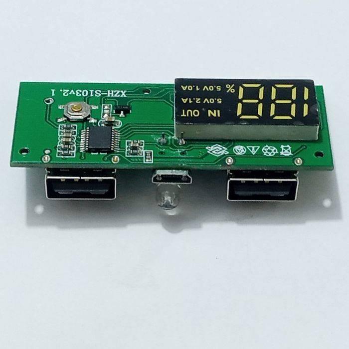 Dual USB 18650 Battery Charger Power Bank Module 5V 1A 2A - a green circuit board with two USB ports, a micro-USB port, a button, an LED, and a display.