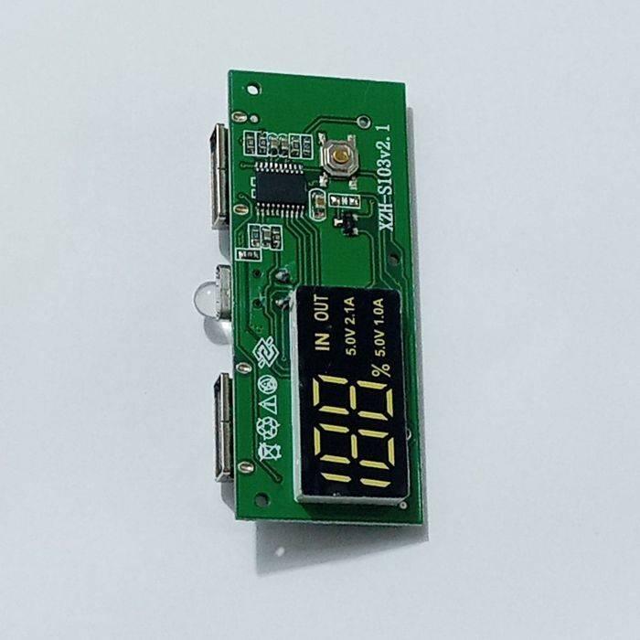 Dual USB 18650 Battery Charger Power Bank Module 5V 1A 2A - a green circuit board with two USB ports, an LED light, a button, and a digital display showing 100%.