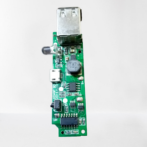 Dual USB Power Bank Module - shown as a green rectangular circuit board featuring a USB port, a micro-USB port, an LED, and a push-button switch.
