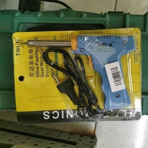 Dual Wattage Electric Temperature Gun Soldering Iron TU-127A - its original yellow and black plastic blister packaging with a power cord and plug.