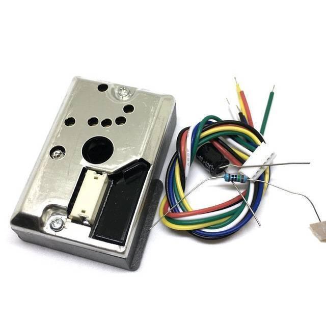 Dust Sensor Module GP2Y1010AU0F Compact Optical Dust Sensor - a metallic sensor unit with a white connector, a bundle of multi-coloured wires, and a loose resistor.