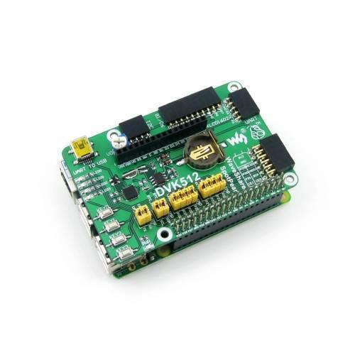 DVK512 Raspberry Pi Expansion Board - a green circuit board featuring a coin cell battery holder, yellow jumpers, push buttons, and multiple pin headers.