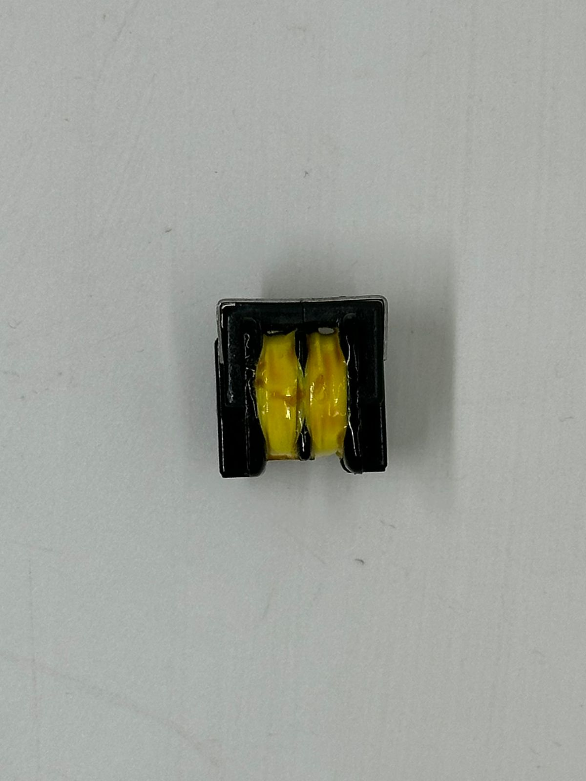 EE16 Pulse Transformer LFU10H-203U 0.45A - shown as a close-up of a small black rectangular electronic component with two yellow-wrapped internal coils.