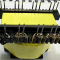 EE33-1.5-15kW Solar Inverter Transformer 23 Pins - a yellow-wrapped electronic component with two rows of metal pins and soldered wire connections.