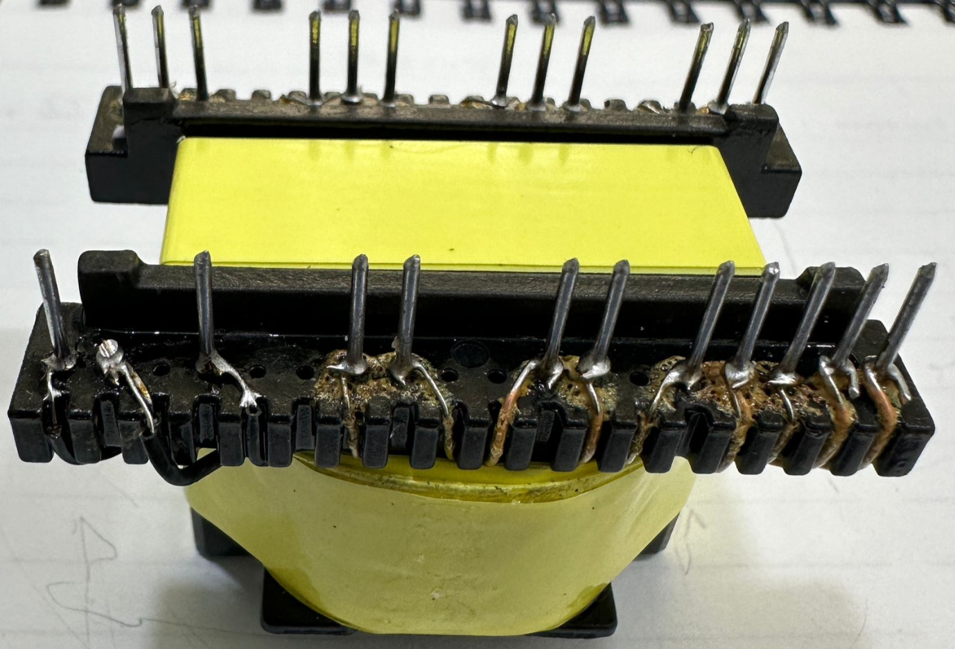 EE33-1.5-15kW Solar Inverter Transformer 23 Pins - a yellow-wrapped electronic component with two rows of metal pins and soldered wire connections.
