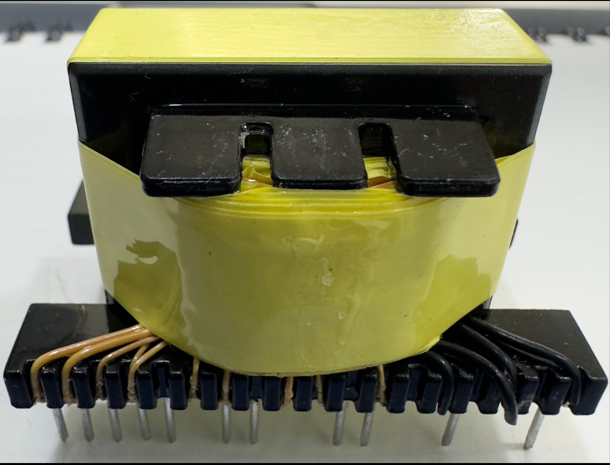 EE33-1.5-15kW Solar Inverter Transformer 23 Pins - a yellow-taped central coil and a black base with 23 metal connector pins.