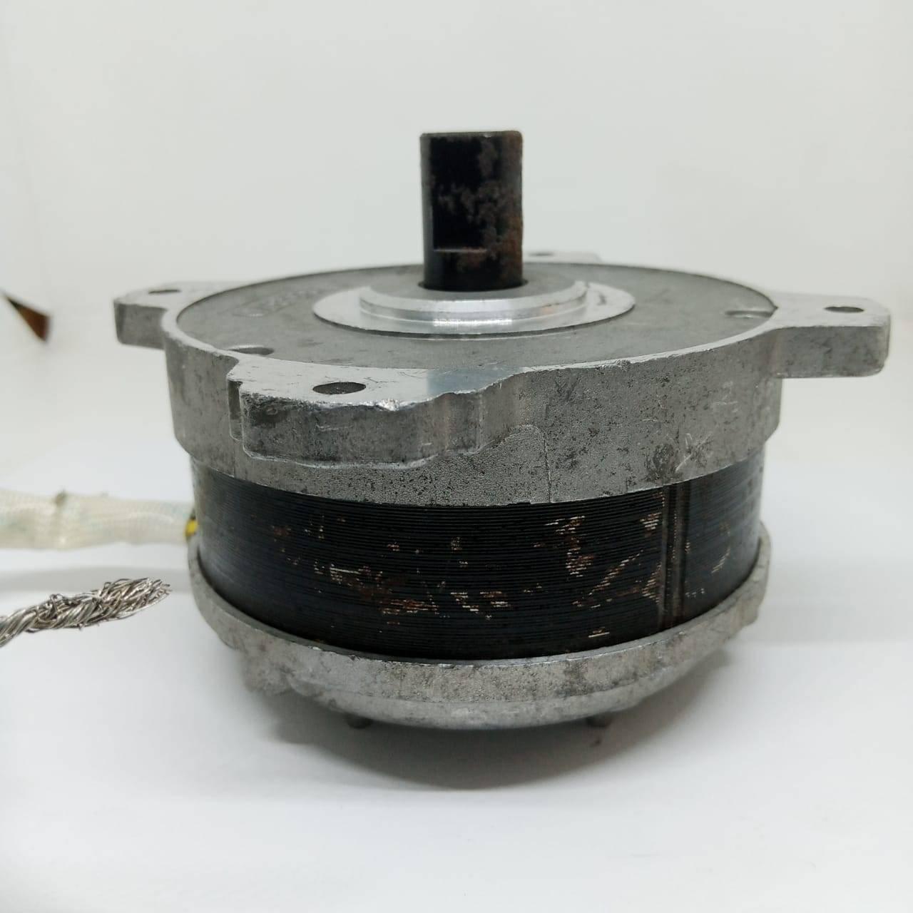 Electric Bike Electric Cycle BLDC Motor Controller And Throttle Handle Accelerator - circular electric motor with a central metal shaft and exposed dark-colored copper windings.