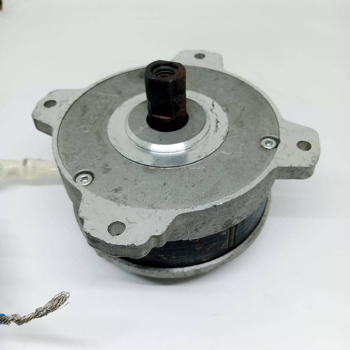 Electric Bike Electric Cycle BLDC Motor Controller And Throttle Handle Accelerator - a silver-coloured circular electric motor with a central threaded shaft and mounting flanges, shown from a top-down angle.