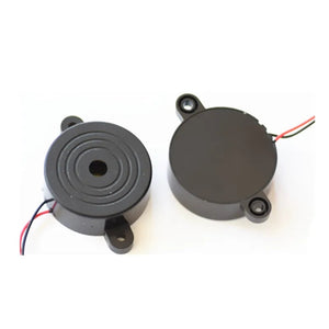 Electronic Buzzer Beep Alarm 3V To 24V - shown as two round black buzzer units with mounting tabs and attached red and black wires on a white background.