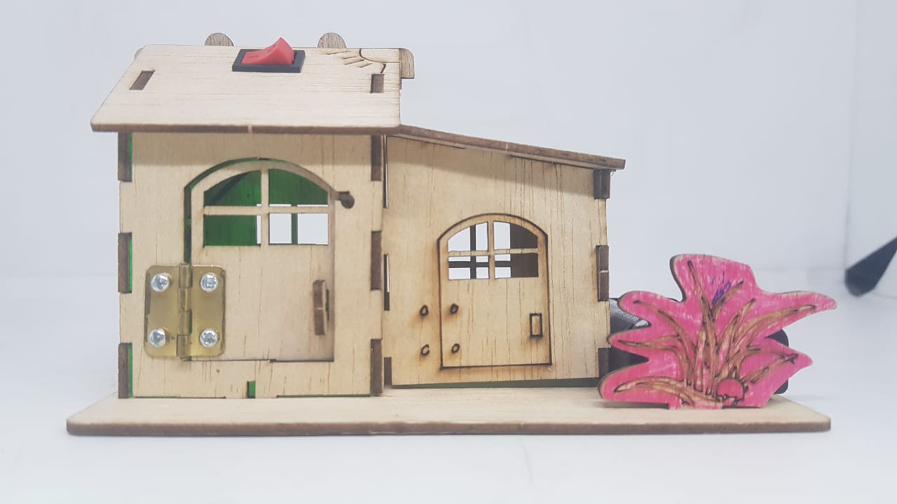 Electronics STEM DIY Home Kit House Construction Light House Model Experiment - a wooden house with two doors, a metal hinge, and a red power switch on top.