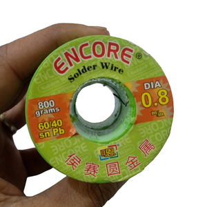 Encore Solder Wire 400 Gram 0.8mm - a close-up of a green spool of solder wire held in a hand with product specifications printed on the label.