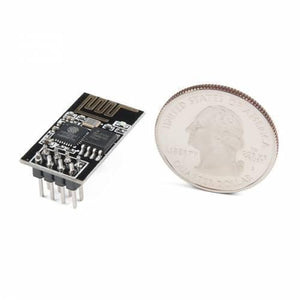 ESP01 ESP 01 ESP8266 WiFi Module - shown in black with a row of pins next to a US quarter coin for size comparison.