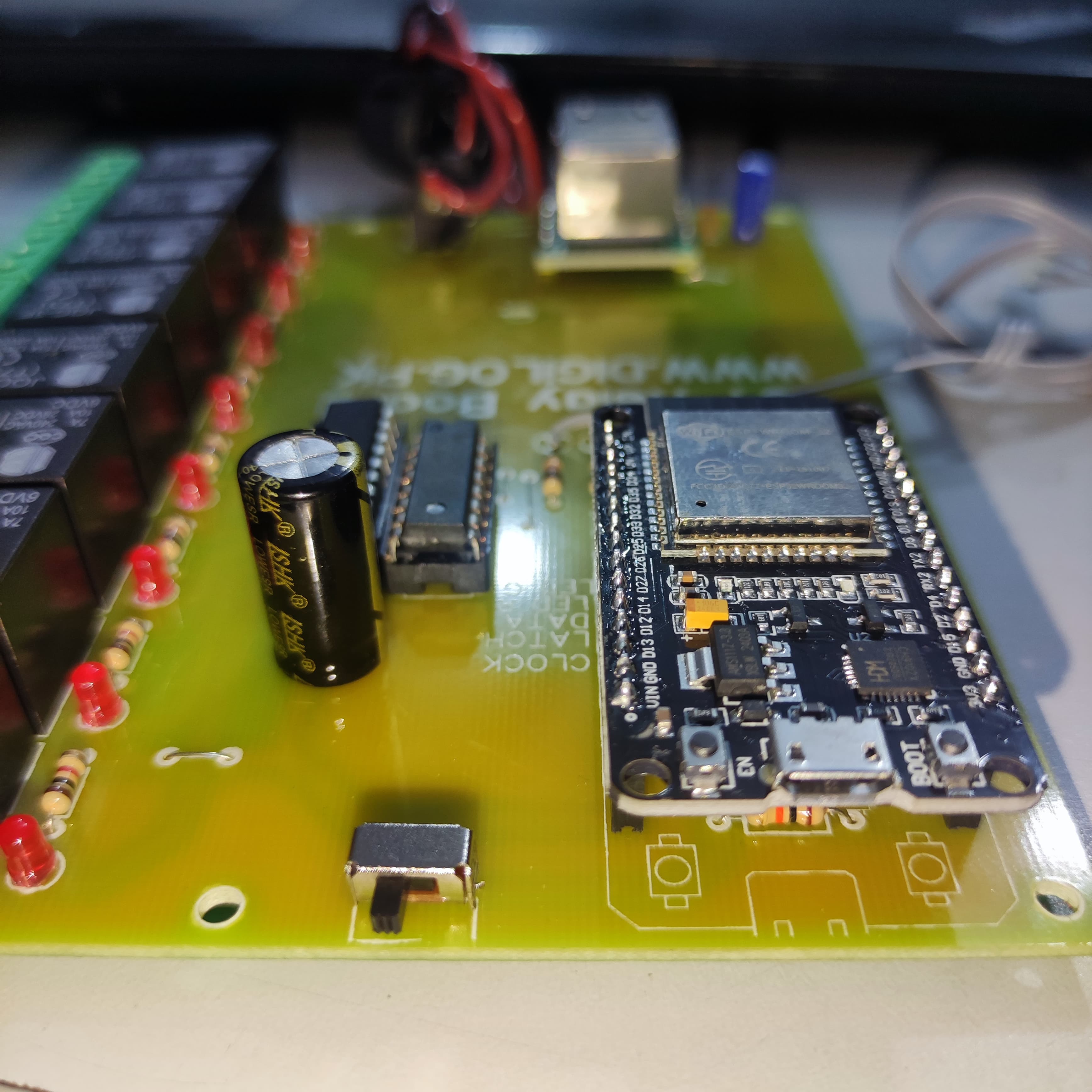 ESP32 Based 8 Channel Relay Board Micro Controller Board WiFi LAN Bluetooth - a yellow PCB with an ESP32 microcontroller, eight black relays, a black capacitor, and a micro USB port.