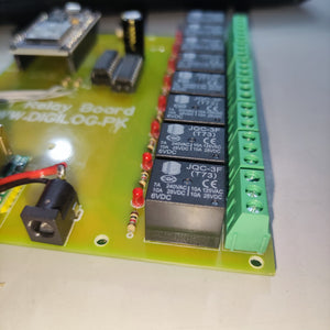 ESP32 Based 8 Channel Relay Board Micro Controller Board WiFi LAN Bluetooth - a close-up view of the green circuit board featuring multiple black JQC-3F relays, red LED indicators, and a power jack.
