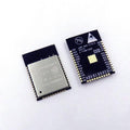 ESP32 ESP-wroom-32 - shown from the front with a metal shield and from the back displaying the printed pinout labels on a black circuit board.