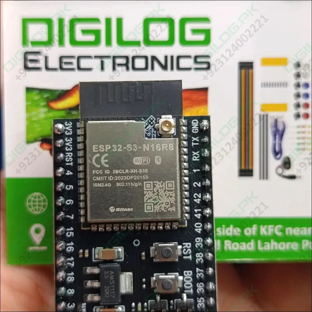 ESP32-S3 Devkitc-1 N16R8 Development Board – 16MB Flash, 8MB Psram, Wi-Fi & Bluetooth 5.0 Le With External Antenna Connector - a black PCB with a metal shield, two buttons labeled RST and BOOT, and header pins, with accessories nearby.