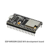 ESP32 WROOM32U Wrover Module WiFi Module - ESP-WROOM-32UE Wifi development board is a black rectangular circuit board with a silver metal shield, a micro-USB port, and two push buttons.