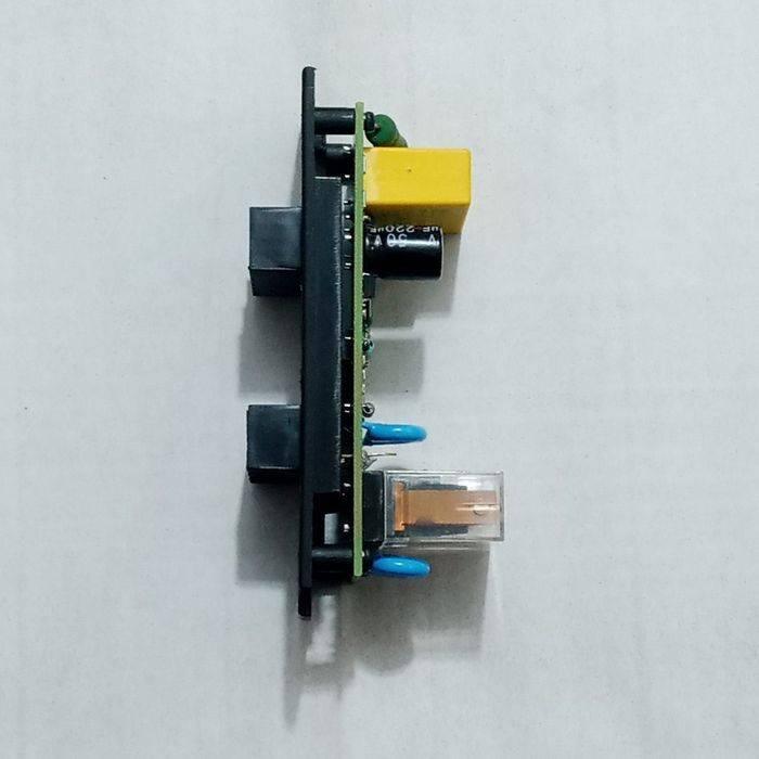 Espa Pressure Controller Circuit - Card - shown from a side profile, featuring a green PCB with a yellow relay, a black capacitor, and two black ports.