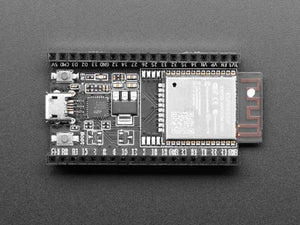 Espressif ESP32 Wroom 32D Development Board - a black rectangular circuit board with a micro-USB port, two push buttons, and a metal-shielded module.