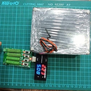 Euler | Raspberry Pi UPS 5V Battery Backup - shown with a green circuit board, four resistors, toggle switches, and a USB detector displaying 5.08V and 2.23A.
