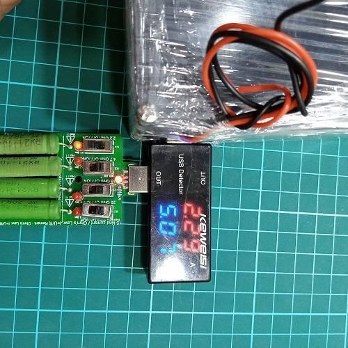 Euler | Raspberry Pi UPS 5V Battery Backup - Euler | Raspberry Pi UPS 5V Battery Backup connected to a USB detector displaying 5.0V and 2.29A, with four green resistors and switches on a circuit board.