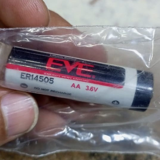 Eve ER14505 AA 3.6V Lithium-ion Battery - Long-lasting Power For Your Devices - clear plastic wrapper, showing the black and white cylindrical body with printed specifications.