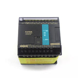Fatak PLC FBS-24MCT2-AC High Speed PLC - a black rectangular controller with screw terminals, a central status indicator panel, and a communication port on the front.