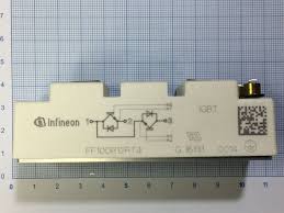FF100R12RT4 IGBT-module - a white rectangular electronic component with a schematic diagram and Infineon logo, placed on a blue grid background.
