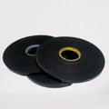 Foam Tape Double Sided For LED Extrusion Profiles - two black circular rolls of adhesive tape stacked on a white surface.