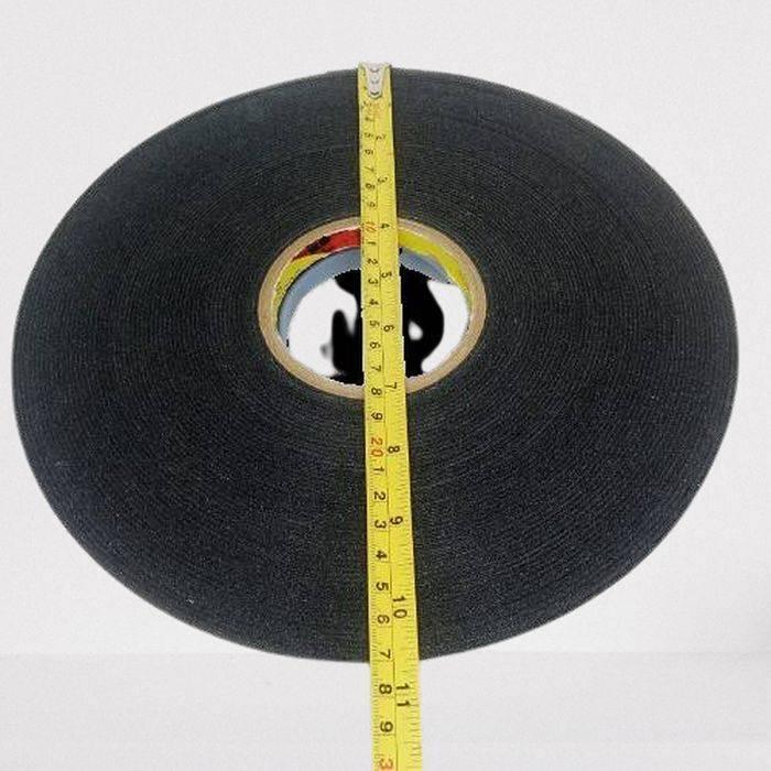 Foam Tape Double Sided For LED Extrusion Profiles - shown as a black circular roll being measured by a yellow tape measure placed across its diameter.