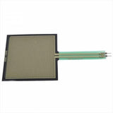 Force Sensitive Resistor Square Sensor Fsr 406 - a flat, square black sensor with a gold-colored grid pattern and a green tail with two metal pins.