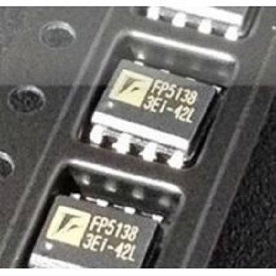 FP5138 Boost Controller SMD IC - close-up view of two black surface-mount integrated circuit chips with white text markings, packaged in a plastic tray.