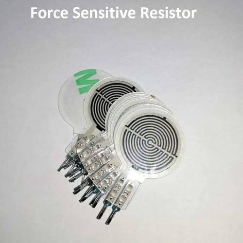 FSR402 Force Sensitive Resistor Fsr - a stack of circular white sensors with black spiral patterns and two-pin connectors at the base.