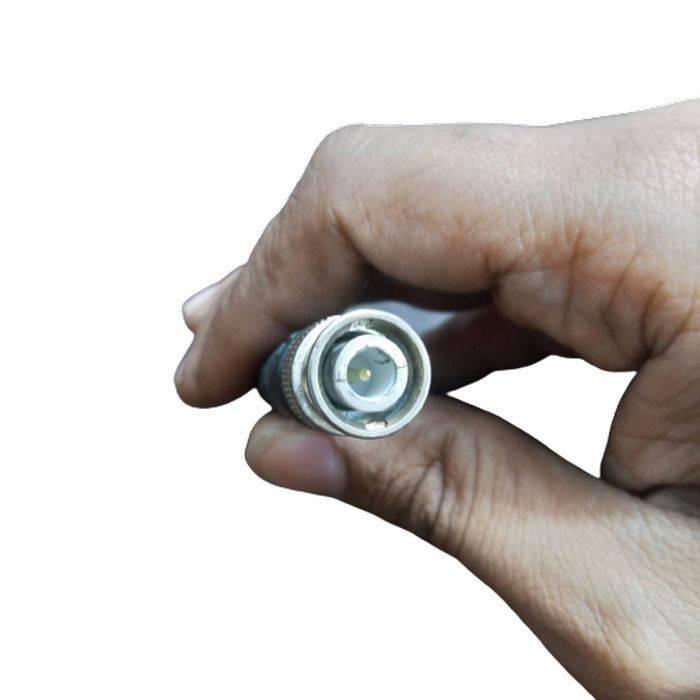 Function Generator Cable Or BNC To Alligator Cable - a close-up shot showing a hand holding the silver and black BNC connector end of the cable.