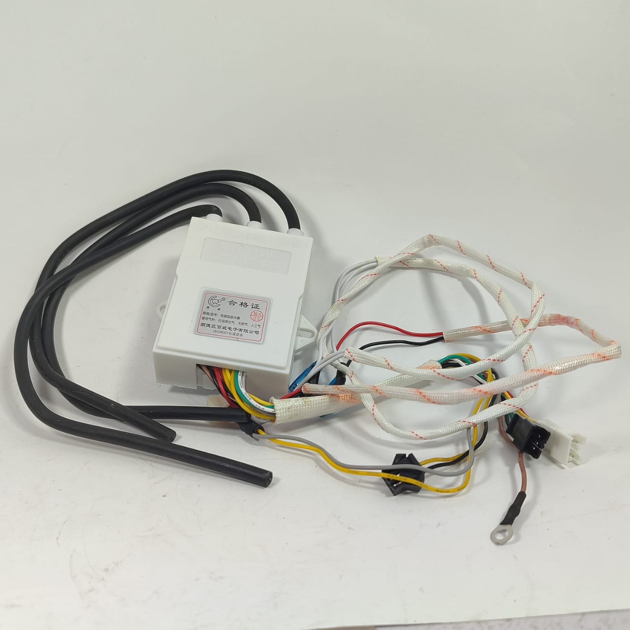Gas Stove Double Igniter With Temperature Control Display pulse igniter Geyser kit - white rectangular control box with attached black and white wires.