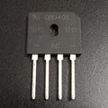 GBU406 4A 600V Single-Phase Bridge Rectifier USED - a black rectangular electronic component with four metal pins and printed markings including AC, +, and -.