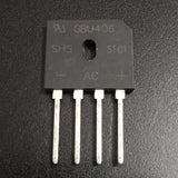 GBU406 4A 600V Single-Phase Bridge Rectifier USED - a black rectangular electronic component with four metal pins and printed markings including AC, +, and -.
