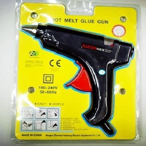 Glue Gun For 11mm Glue Sticks 80W 50/60Hz - a black hot melt glue gun with a red trigger, shown inside its original yellow retail blister packaging.