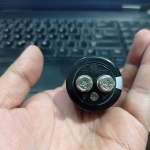 Green-cap 2.7V 400F Super Capacitor - a close-up view of the black cylindrical top featuring two metal screw terminals marked with plus and minus signs.
