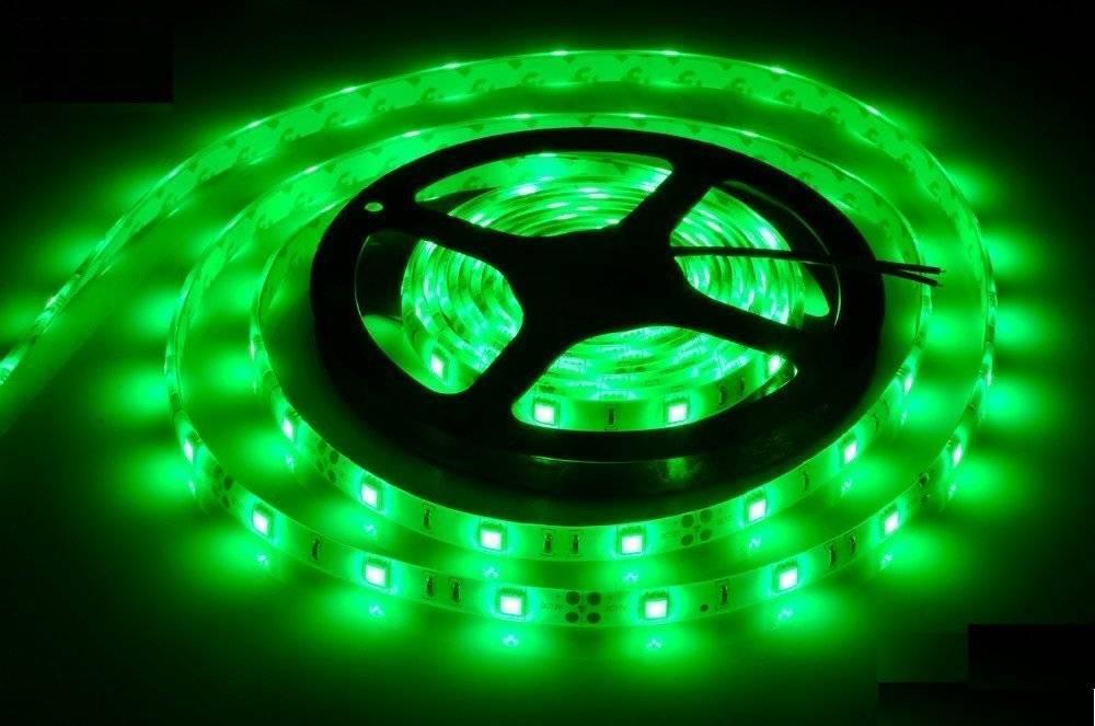 Green Color 5V DC Strip Light Rolls 5 Meter Each - shown as a coiled LED strip glowing bright green on a black plastic spool with two wire leads.